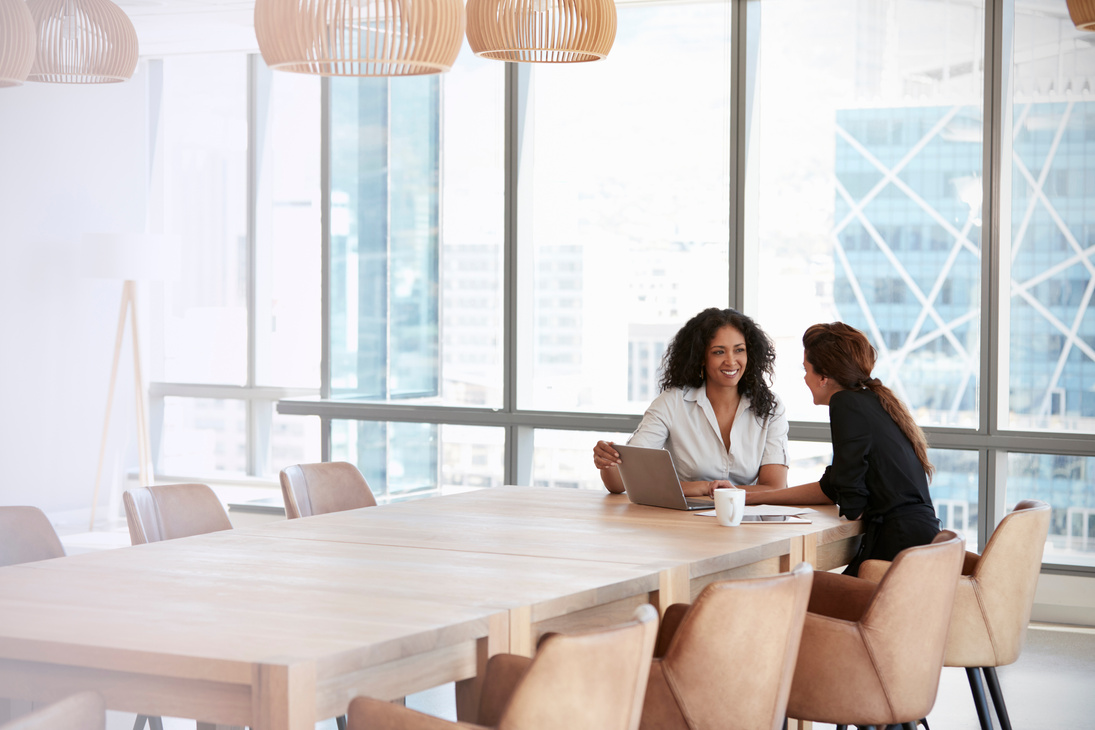 Collaborating Colleagues Working in a Boardroom 